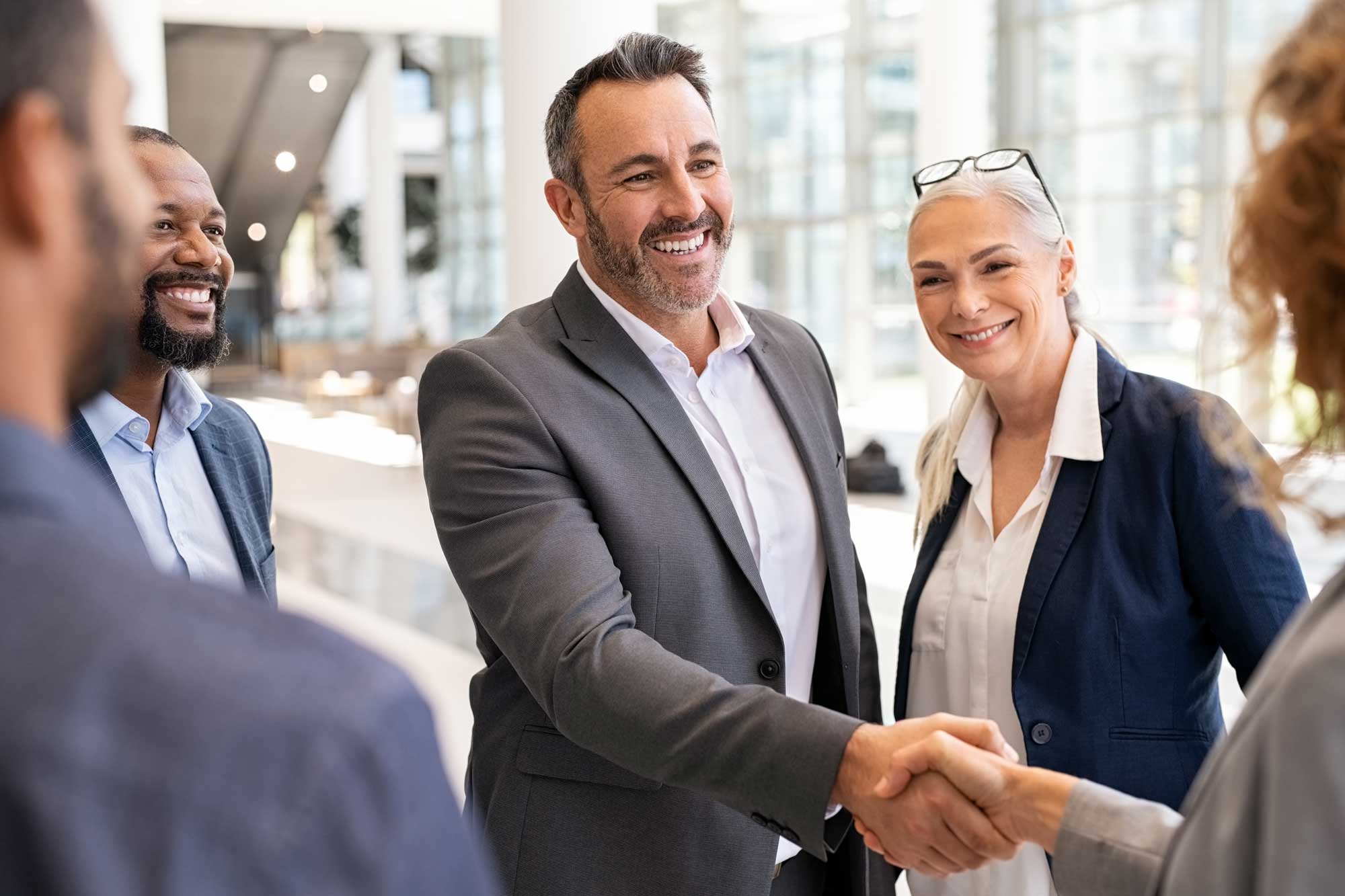 business-people-shaking-hands-in-meeting